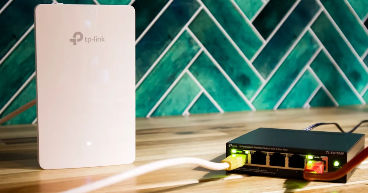 A wi-fi router and a network switch sit side-by-side.